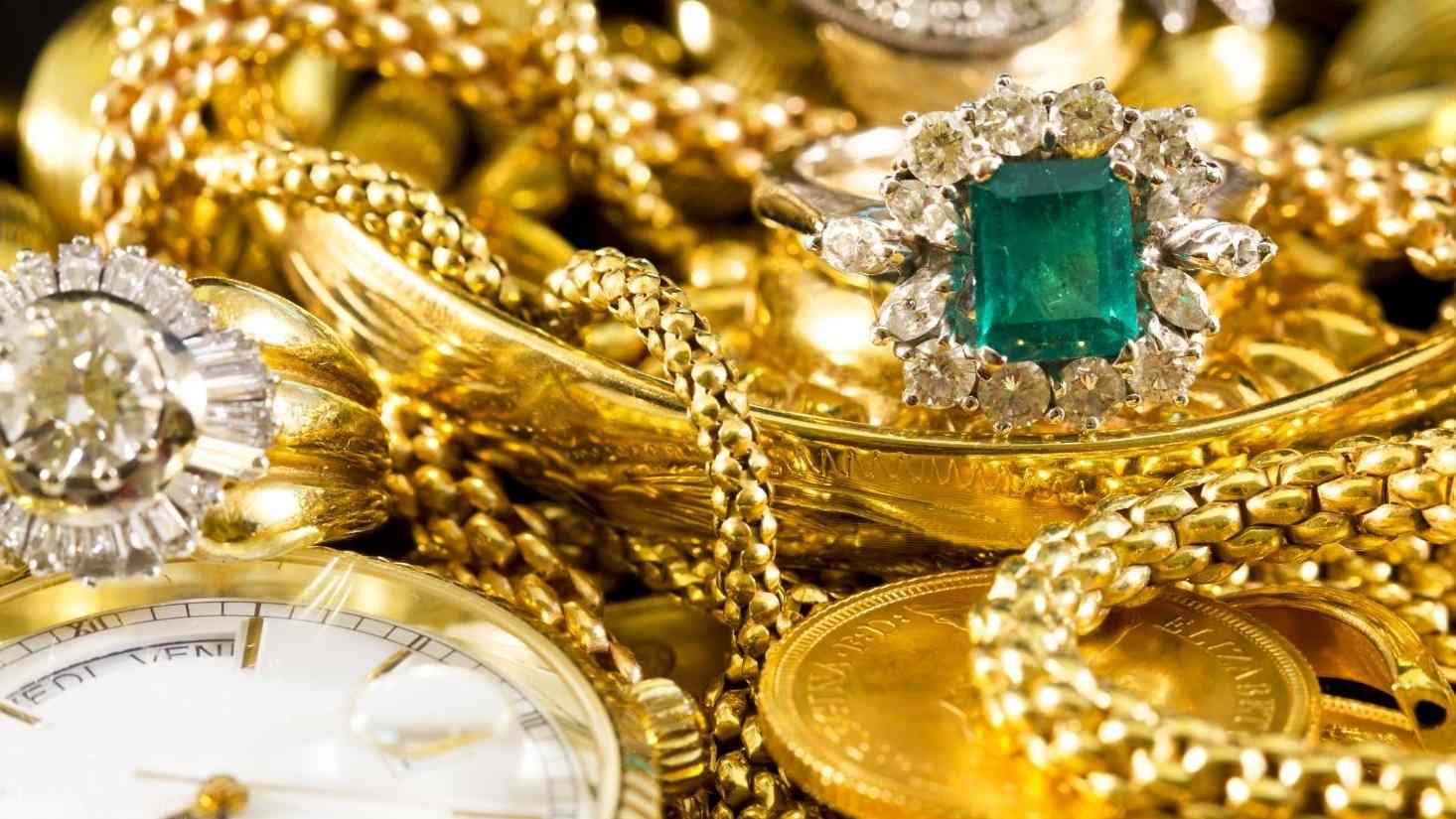 Jewellery, watches and coins prepared for an in-store appraisal.
